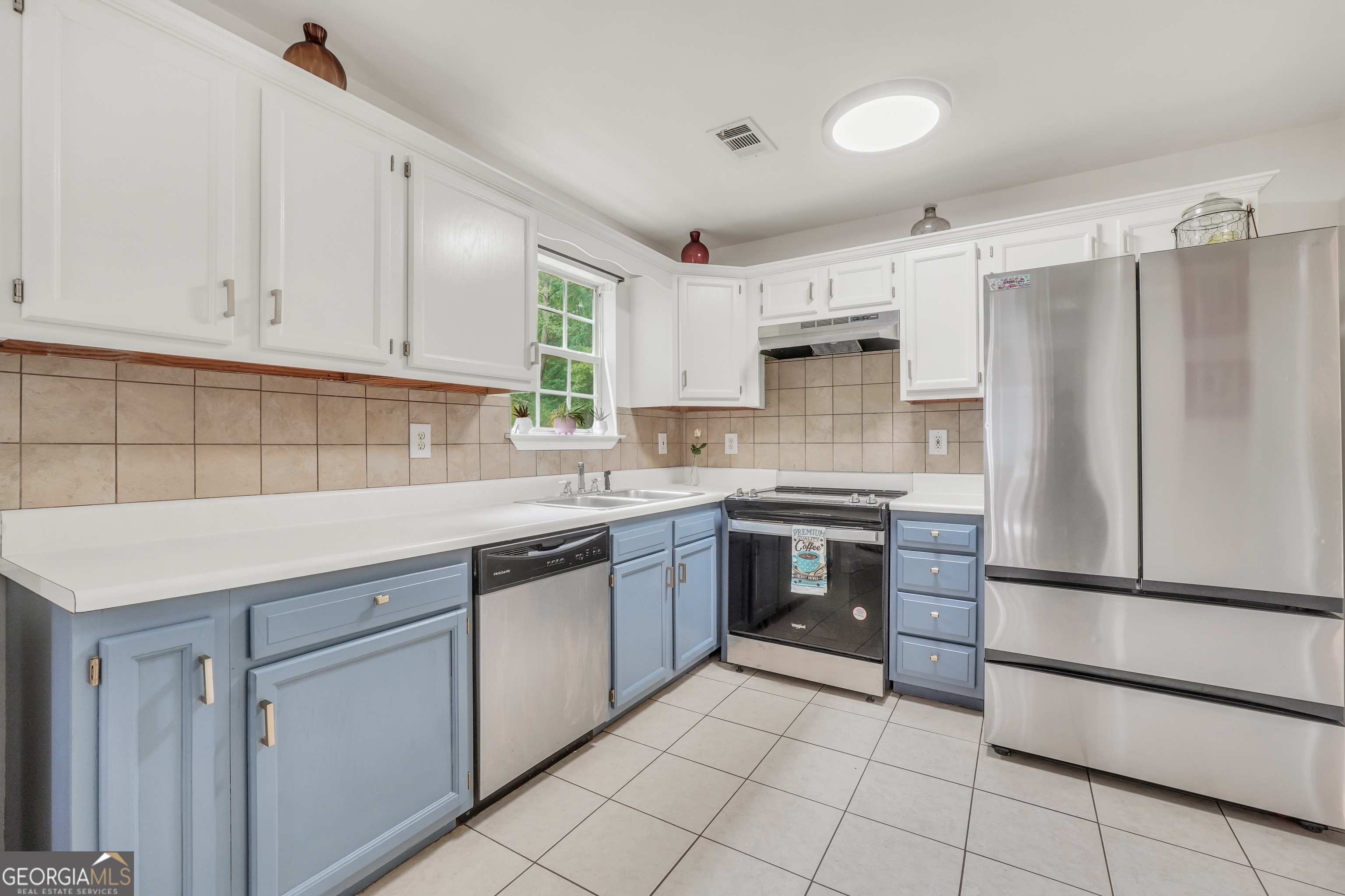 110 Westeria Way Jackson, GA 30233 - Photo 10 of 45 a kitchen with white cabinets and white appliances