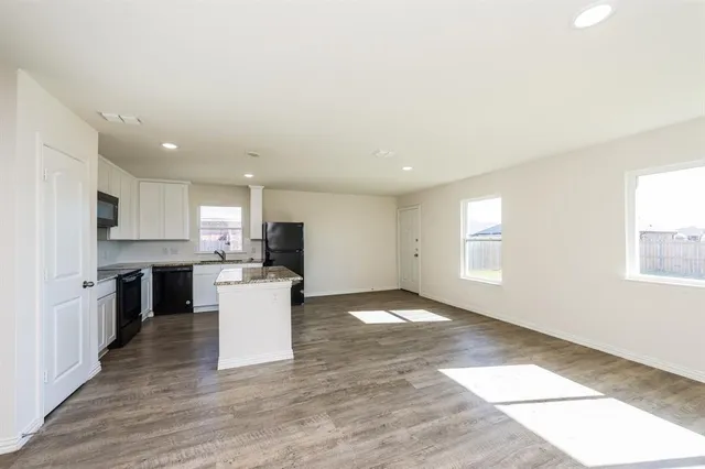 a kitchen with a white cabinets and counter space