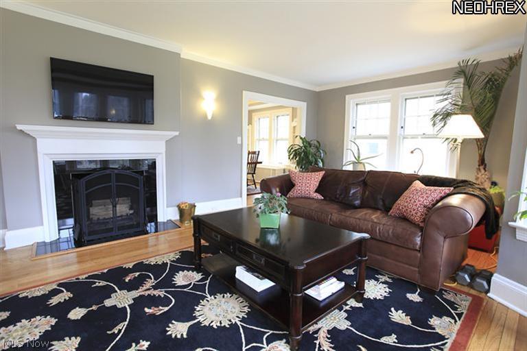 15803 Fernway Road Cleveland, OH 44120 - Photo 2 of 25 A relaxing color scheme highlights the trim and wood-burning fireplace in the Living Room.