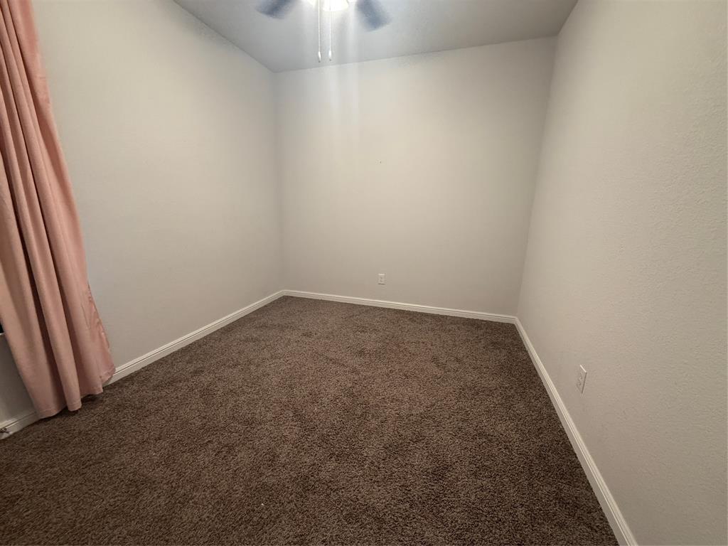 1110 Pacifica Trail Cleburne, TX 76033 - Photo 13 of 24 an empty room with a workbench