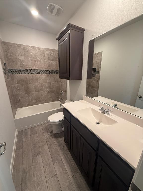 1110 Pacifica Trail Cleburne, TX 76033 - Photo 15 of 24 a bathroom with a sink a toilet and shower