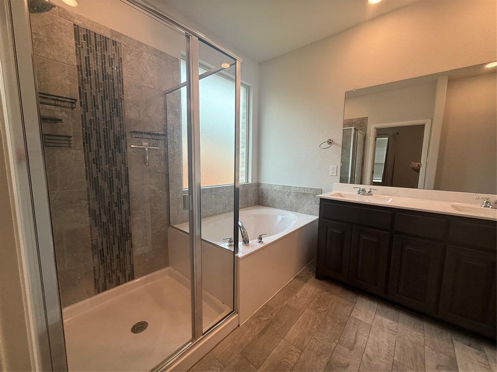 1110 Pacifica Trail Cleburne, TX 76033 - Photo 18 of 24 a bathroom with a tub shower and sink