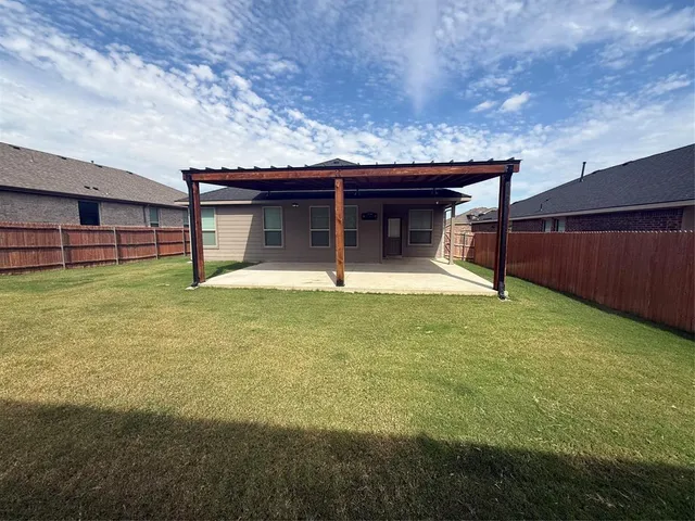 a house with swimming pool in front of it