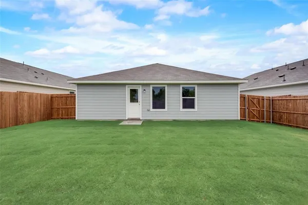 a backyard of a house with lots of green space