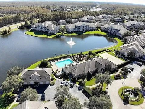an aerial view of a house with a swimming pool yard and outdoor seating