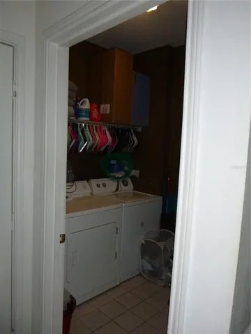 a room with a sink and cabinets