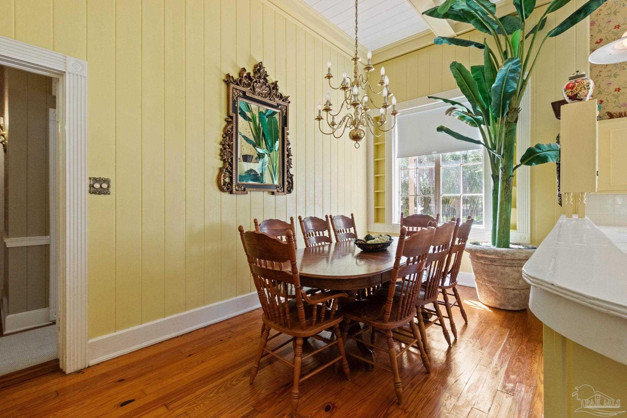 1701 Sowell Road Brewton, AL 36426 - Photo 44 of 72 a view of a dining room with furniture wooden floor and chandelier