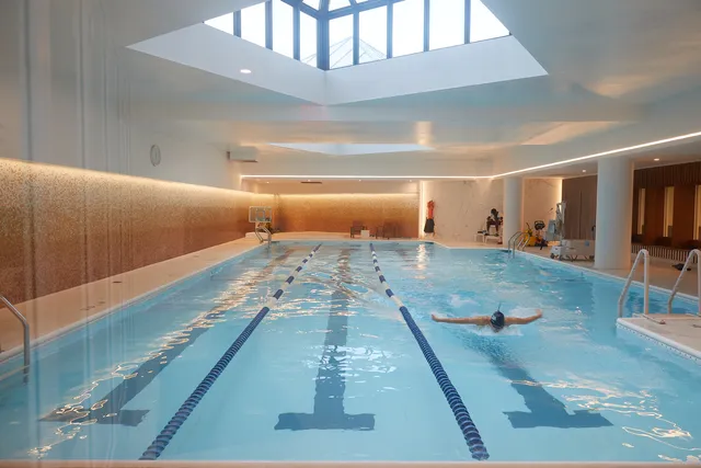 a view of a patio with a table and chairs and potted plants