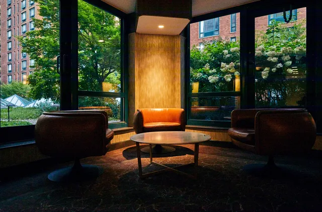 a kitchen with stainless steel appliances a stove microwave and refrigerator