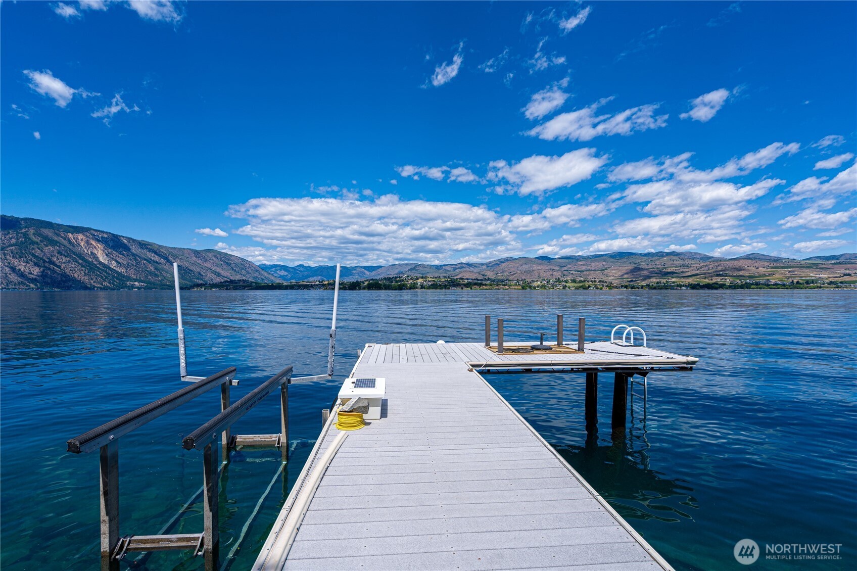 4620 South Lakeshore Road Chelan, WA 98816 - Photo 2 of 40 a roof deck with table and chairs