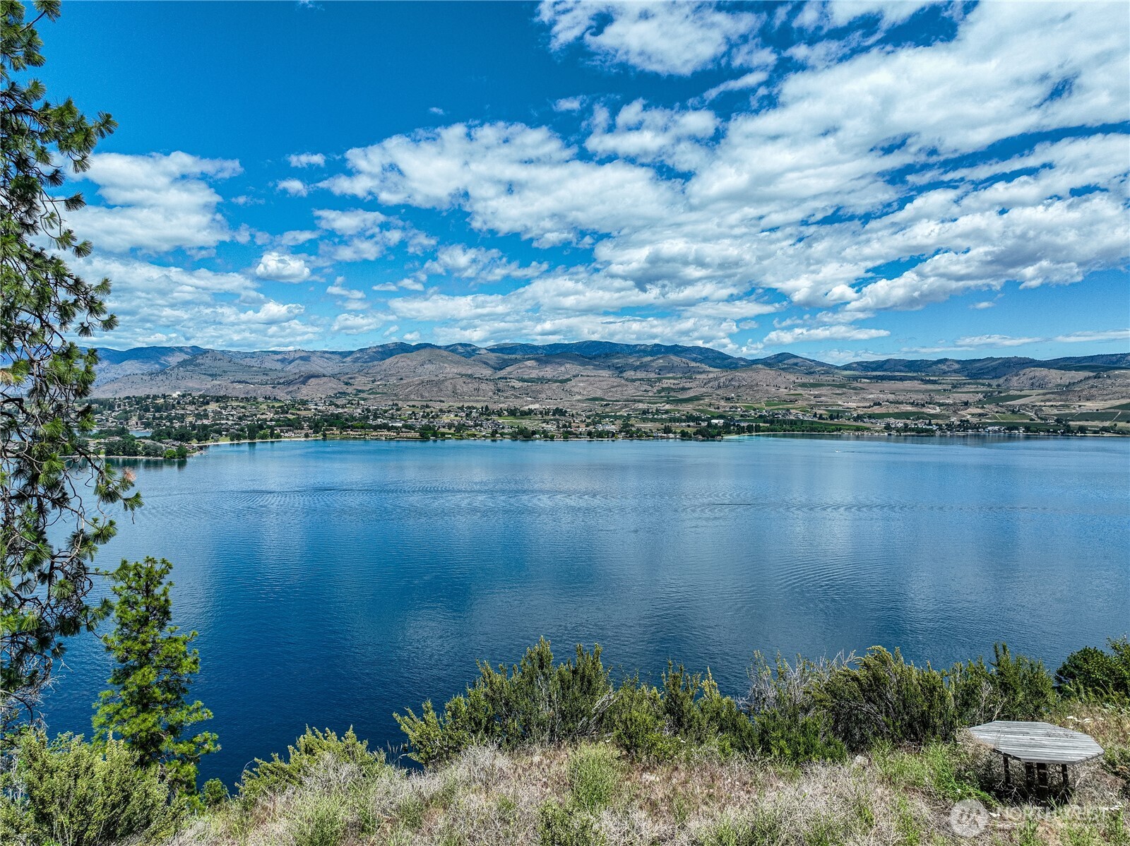 4620 South Lakeshore Road Chelan, WA 98816 - Photo 7 of 40 a view of a lake from a yard