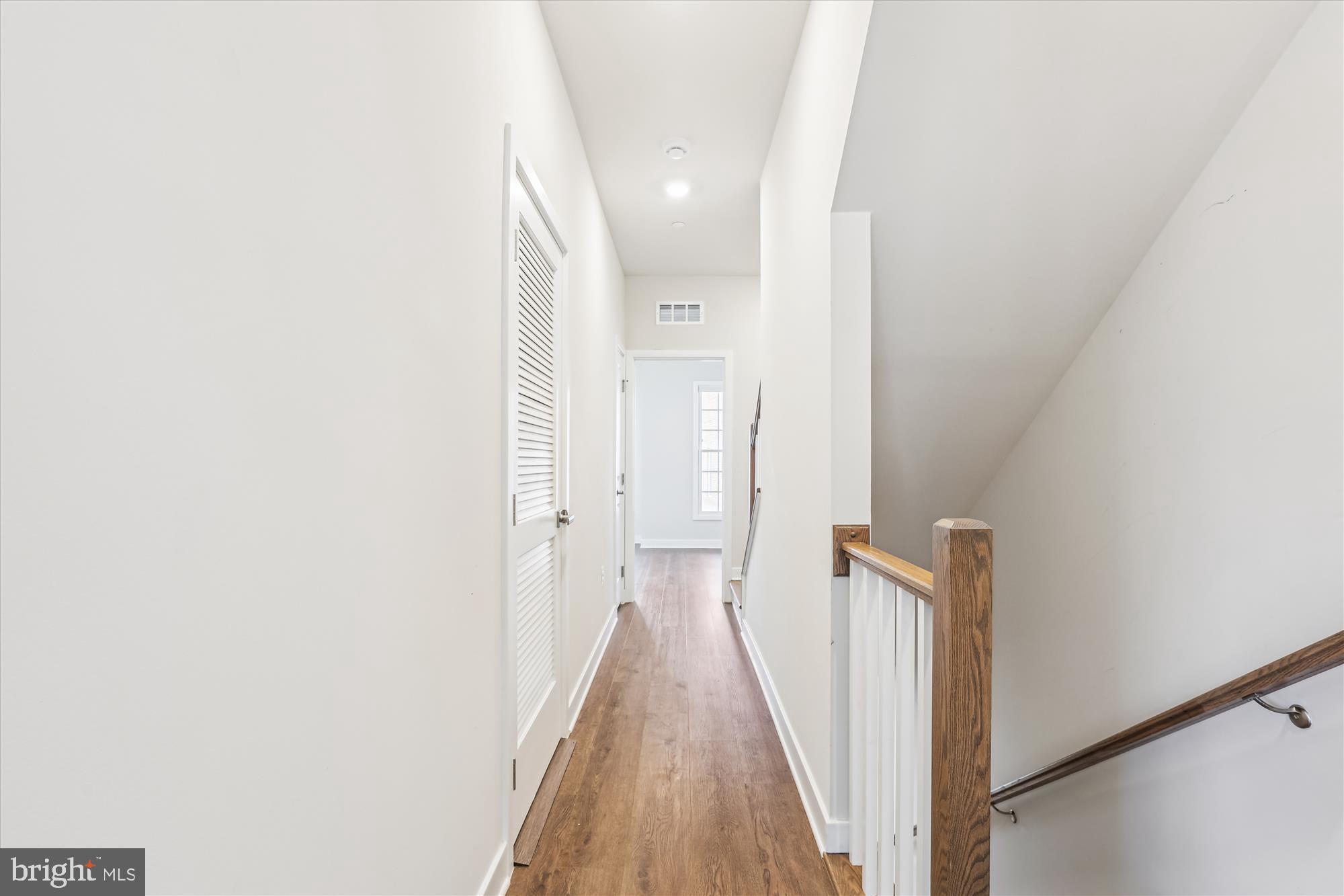 6832 General Davis Drive Northwest Washington, DC 20012 - Photo 17 of 31 a view of a hallway with wooden floor