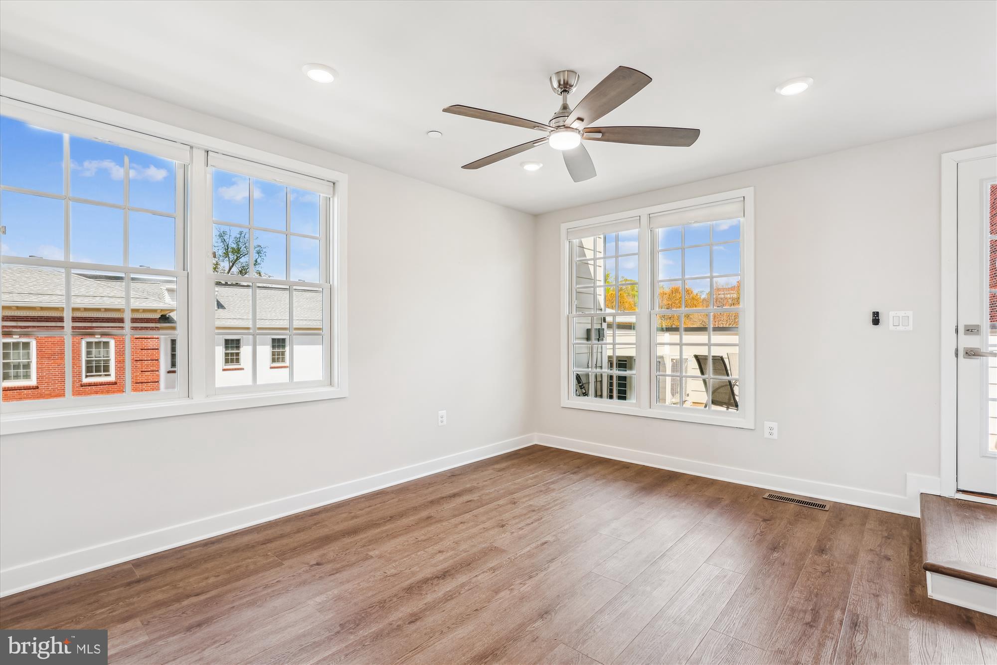 6832 General Davis Drive Northwest Washington, DC 20012 - Photo 18 of 31 a view of an empty room with wooden floor and a window