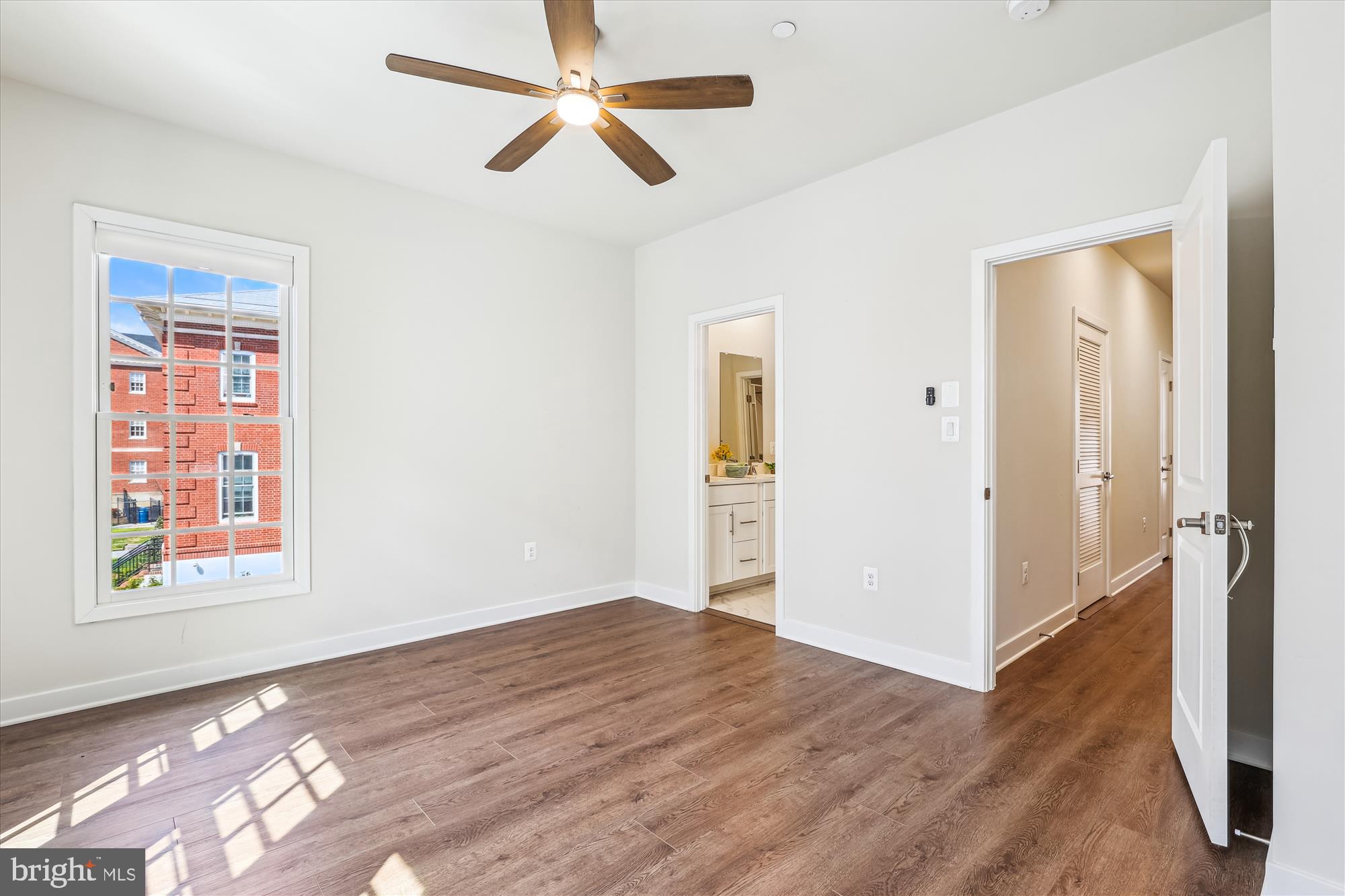 6832 General Davis Drive Northwest Washington, DC 20012 - Photo 19 of 31 a view of empty room with wooden floor and fan