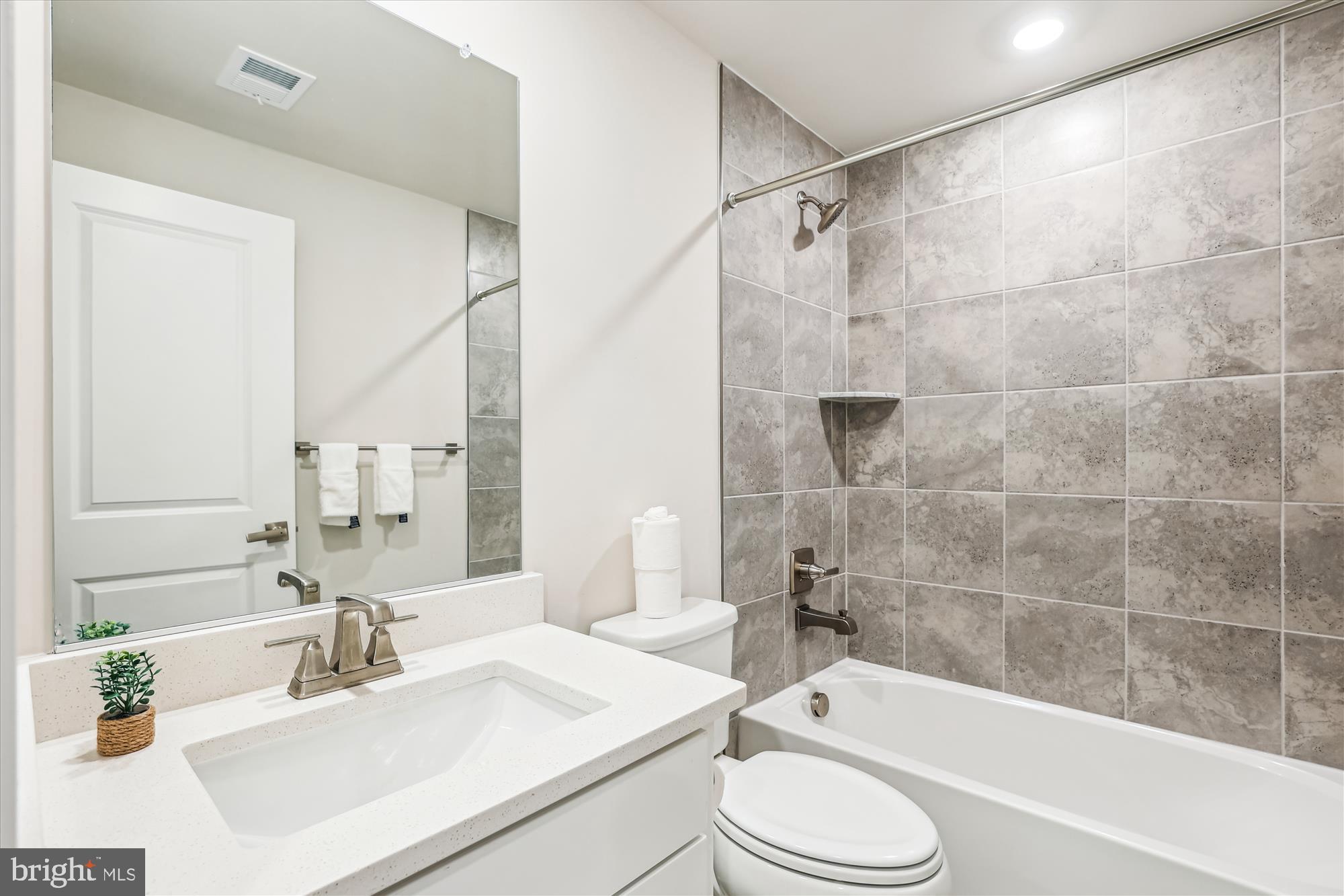 6832 General Davis Drive Northwest Washington, DC 20012 - Photo 20 of 31 a bathroom with a sink a toilet and a bathtub