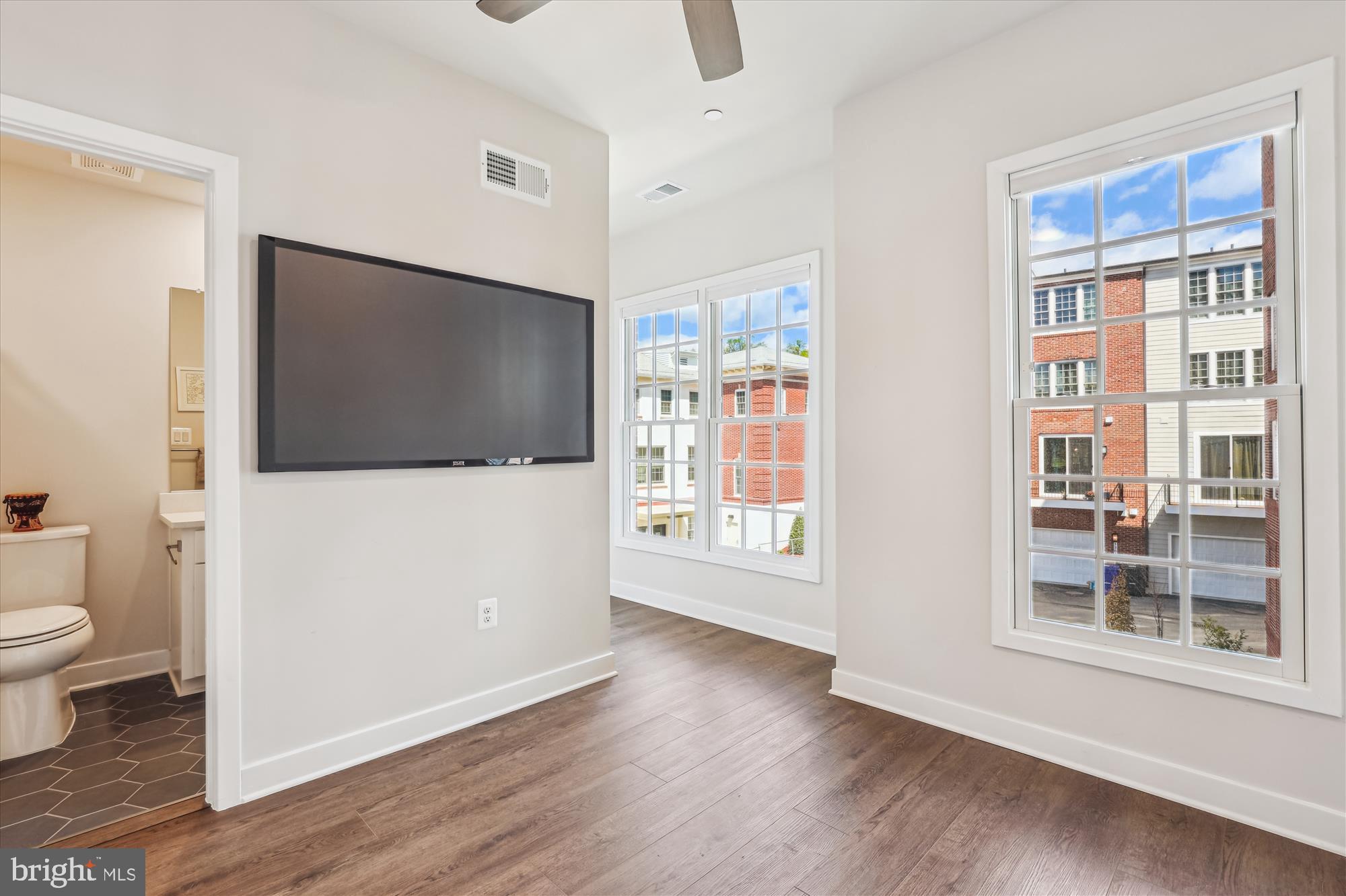 6832 General Davis Drive Northwest Washington, DC 20012 - Photo 21 of 31 a view of a living room with a flat screen tv and floor to ceiling window