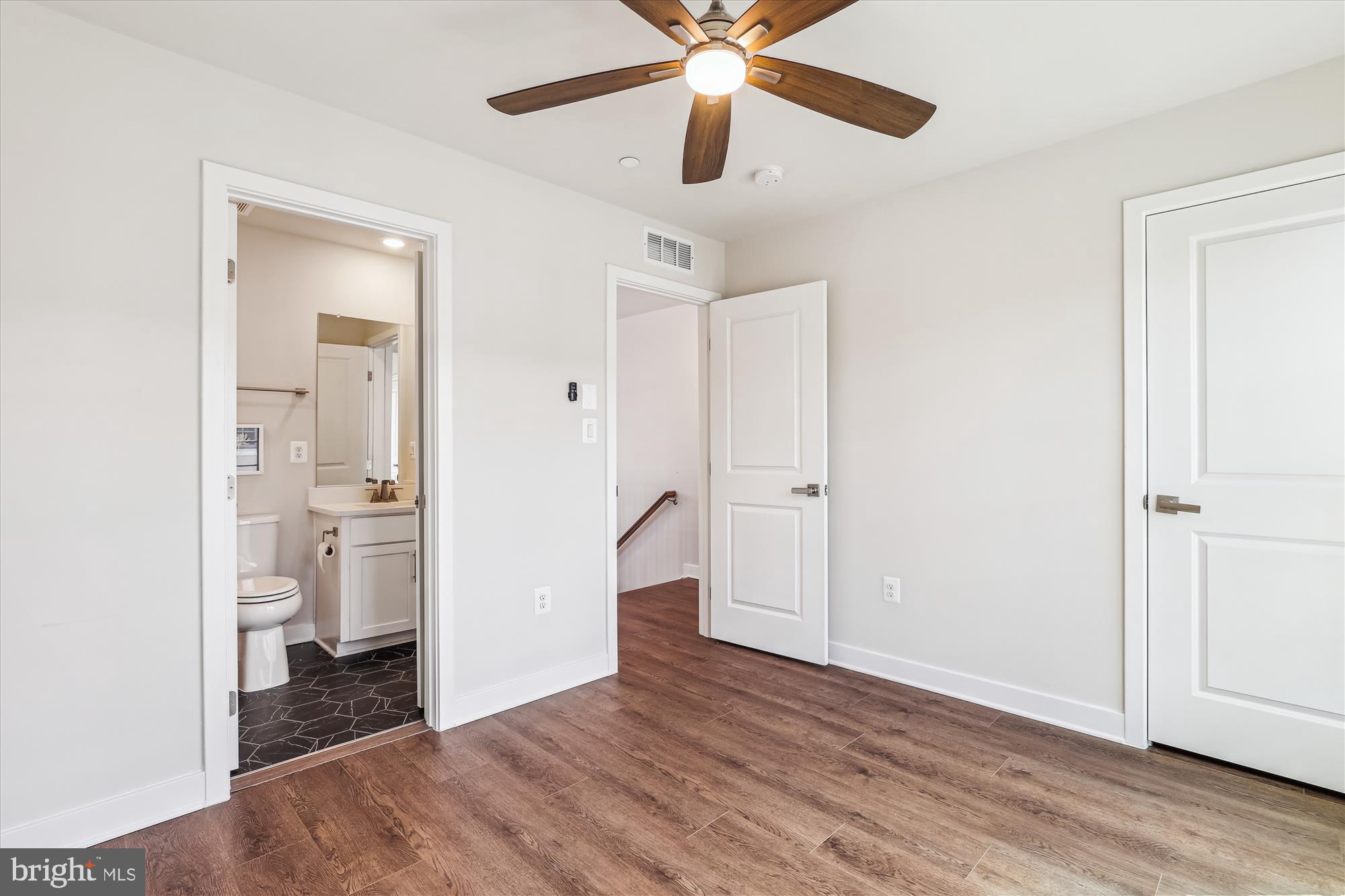6832 General Davis Drive Northwest Washington, DC 20012 - Photo 26 of 31 wooden floor in an empty room and a window