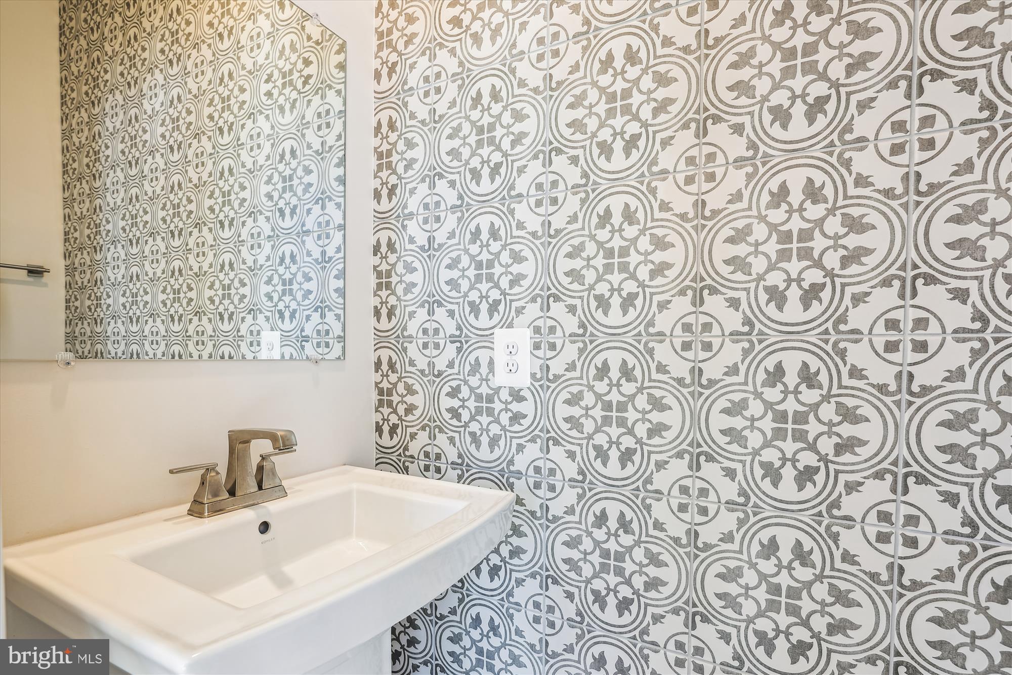 6832 General Davis Drive Northwest Washington, DC 20012 - Photo 29 of 31 a bathroom with a sink and a mirror