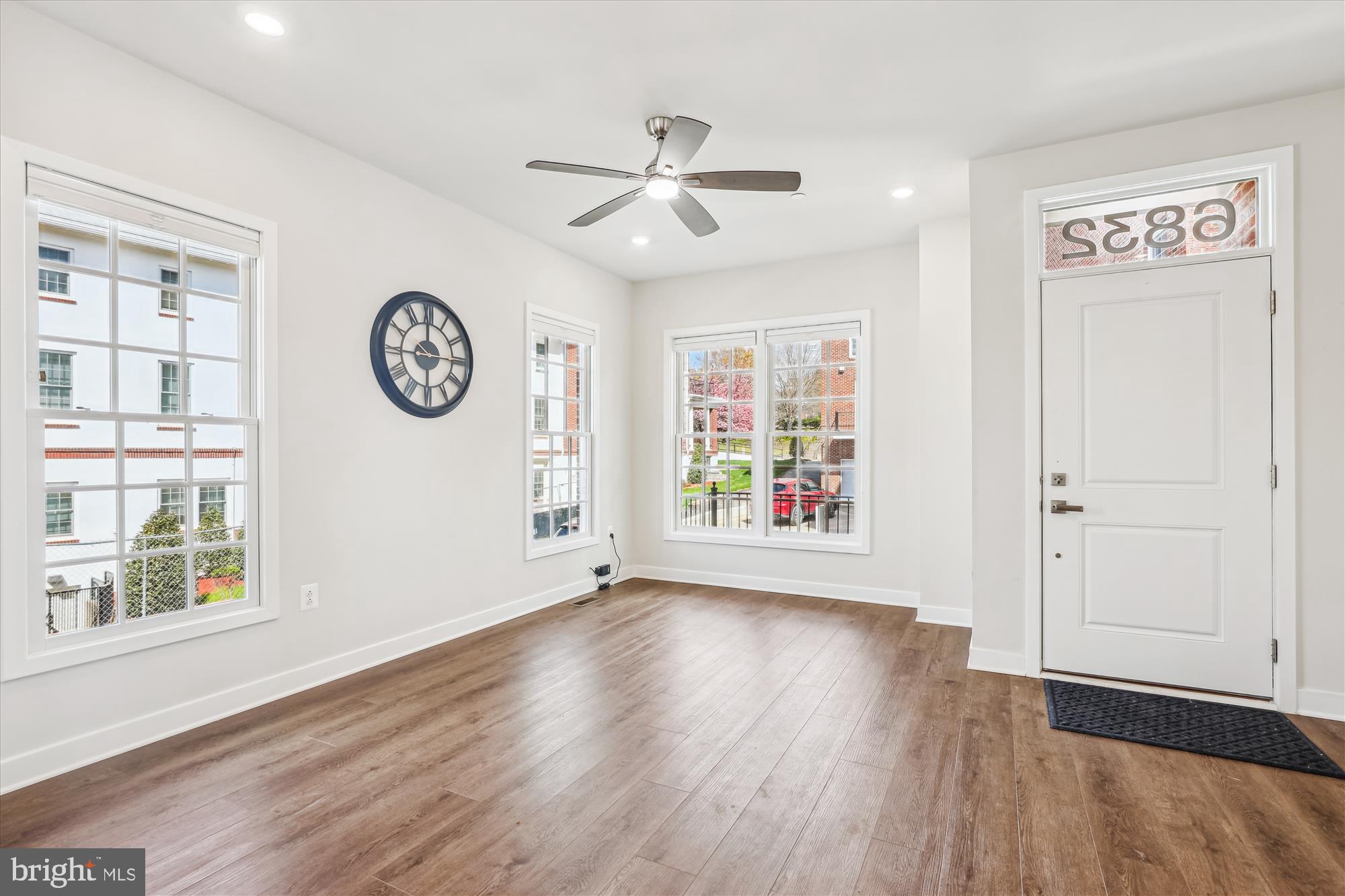 6832 General Davis Drive Northwest Washington, DC 20012 - Photo 3 of 31 a view of an empty room with window and wooden floor