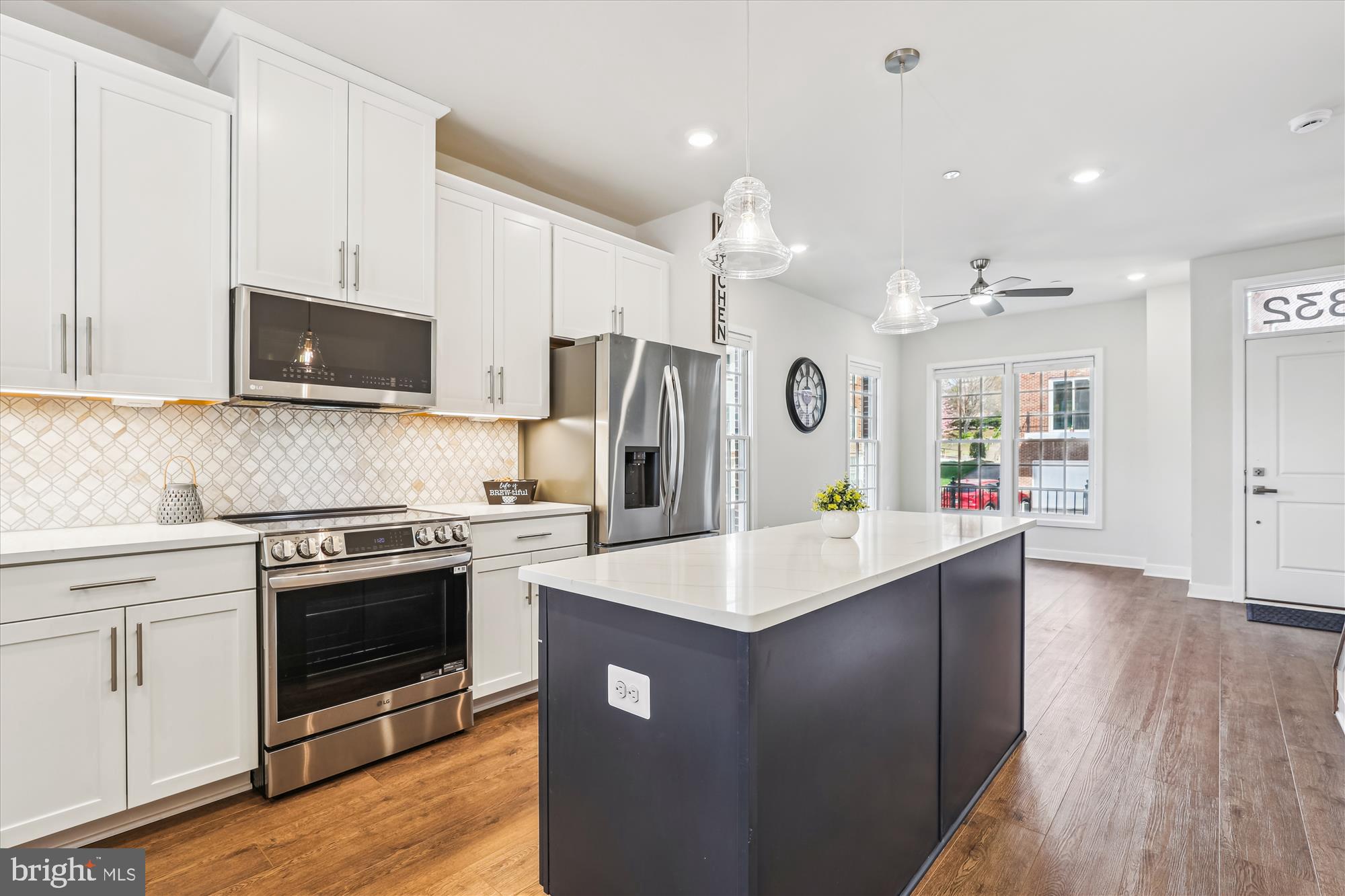 6832 General Davis Drive Northwest Washington, DC 20012 - Photo 6 of 31 a kitchen with a sink a stove and refrigerator