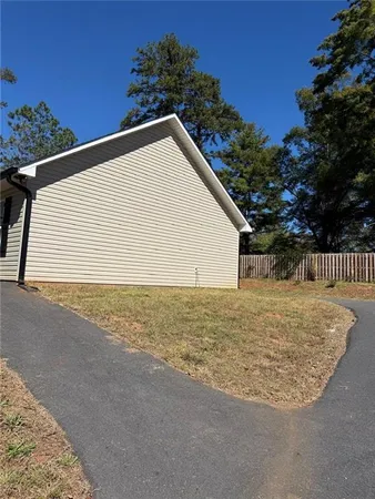 a view of a backyard of the house