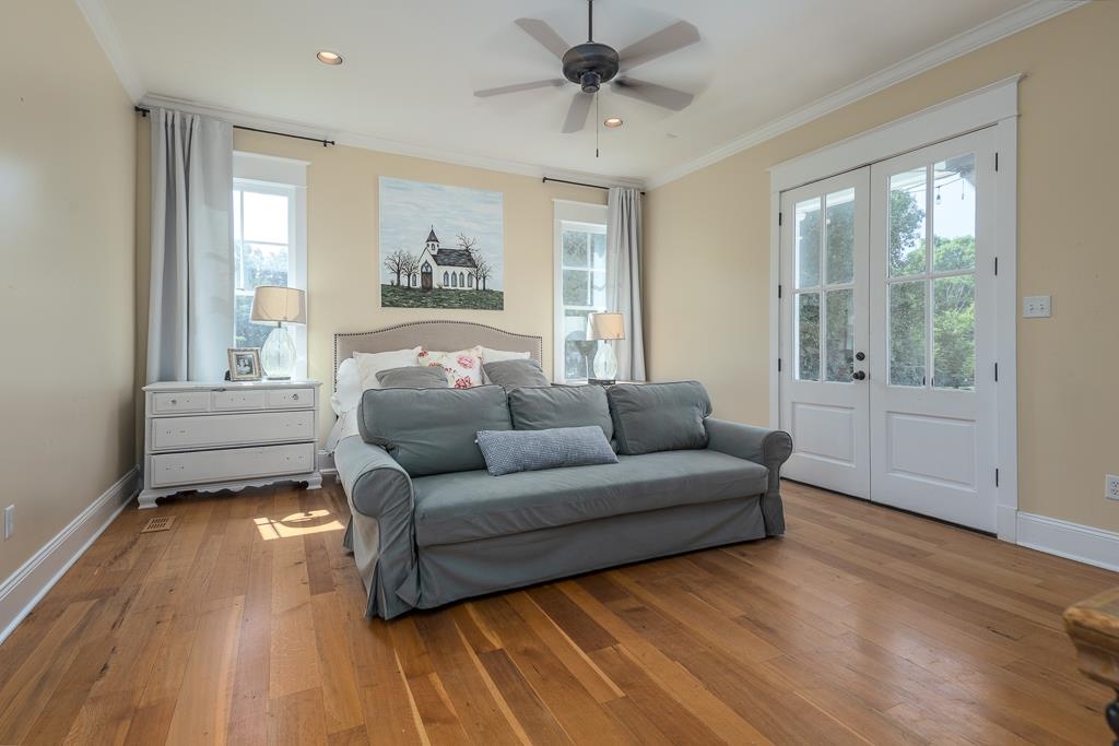 1915 Teague Store Road Somerville, TN 38068 - Photo 27 of 38 Hardwood flooring throughout this bright room featuring a ceiling fan, recessed lighting, and crown molding
