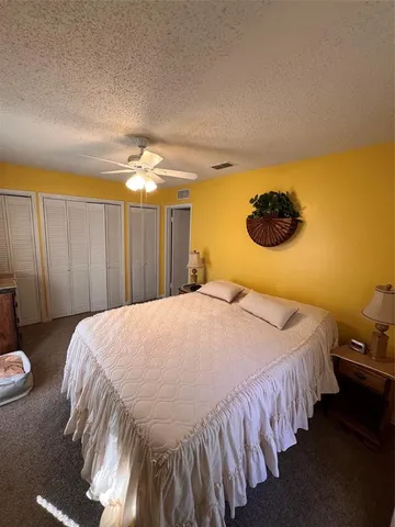 a bedroom with bed and window