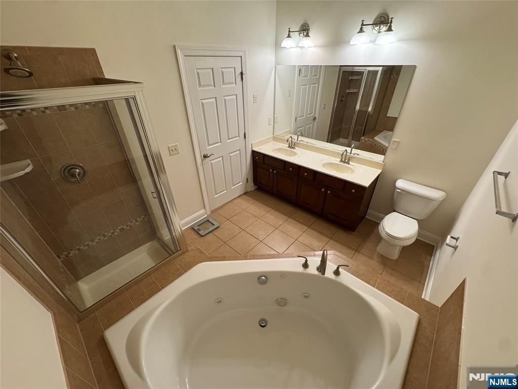 306 April Way Middletown, NJ 07748 - Photo 11 of 26 a bathroom with a tub sink and mirror