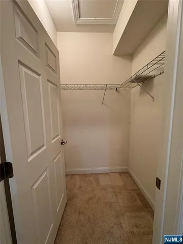 a view of a room with racks on the wall