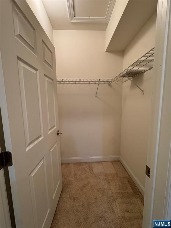 306 April Way Middletown, NJ 07748 - Photo 14 of 26 a view of a room with racks on the wall