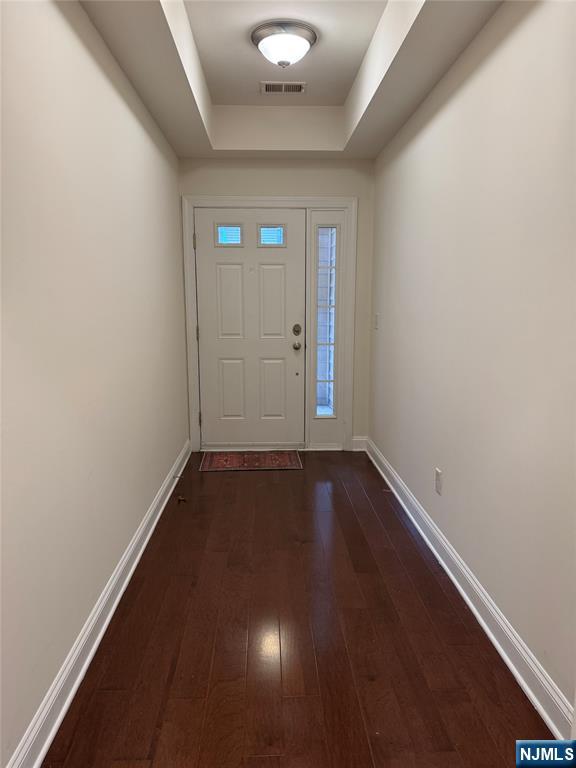 306 April Way Middletown, NJ 07748 - Photo 22 of 26 an empty room with wooden floor and windows