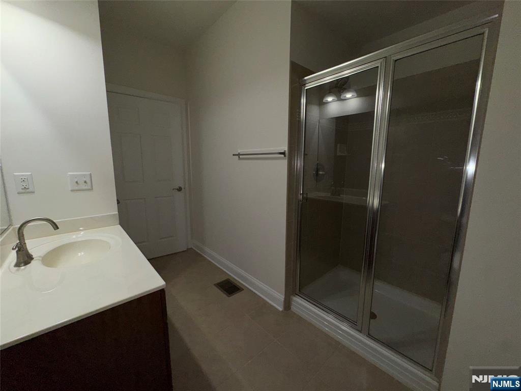 306 April Way Middletown, NJ 07748 - Photo 9 of 26 a bathroom with a sink and shower