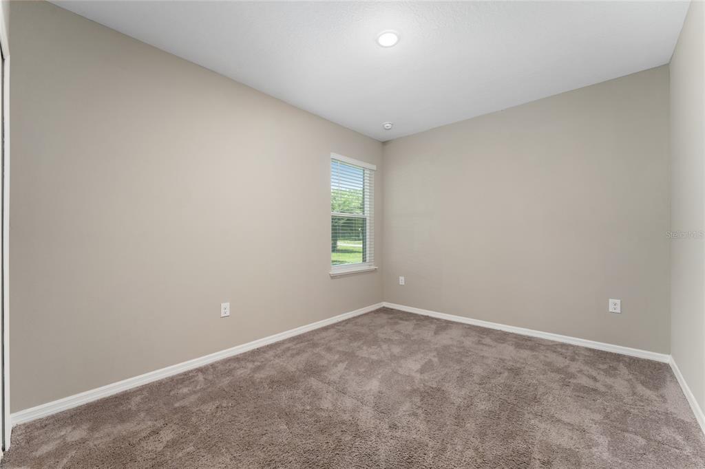 4331 Wayne Road Fruitland Park, FL 34731 - Photo 23 of 46 an empty room with windows