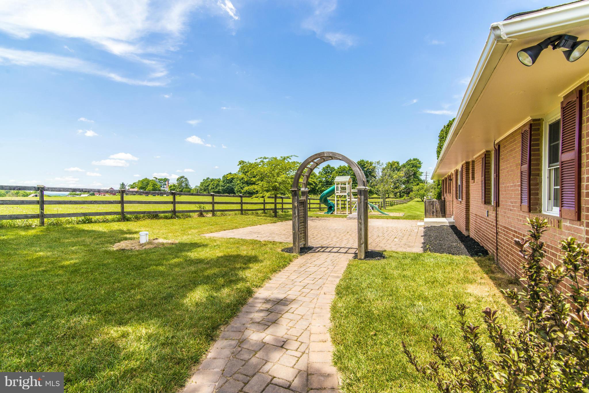 18126 Beallsville Road Poolesville, MD 20837 - Photo 2 of 21 a view of a swimming pool with an outdoor seating and a yard