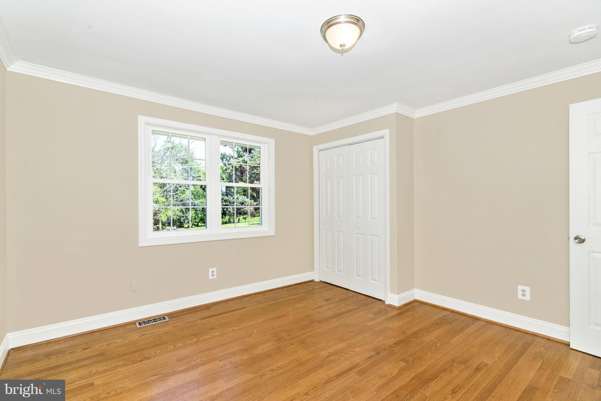 18126 Beallsville Road Poolesville, MD 20837 - Photo 14 of 21 an empty room with wooden floor and windows