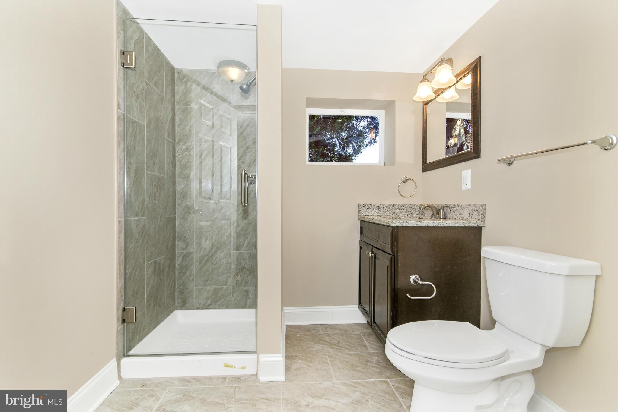 18126 Beallsville Road Poolesville, MD 20837 - Photo 21 of 21 a bathroom with a toilet sink and shower