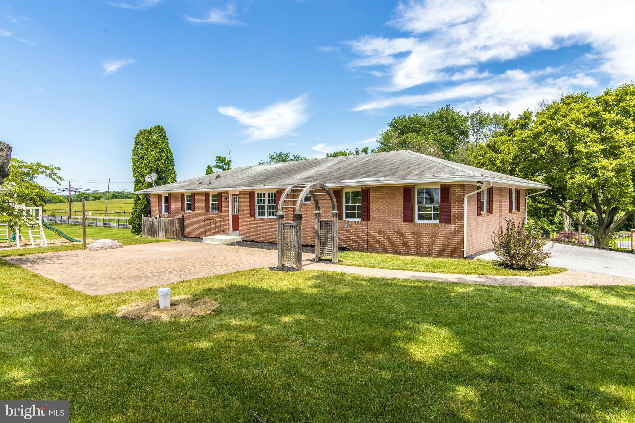 18126 Beallsville Road Poolesville, MD 20837 - Photo 4 of 21 a view of a house with a yard