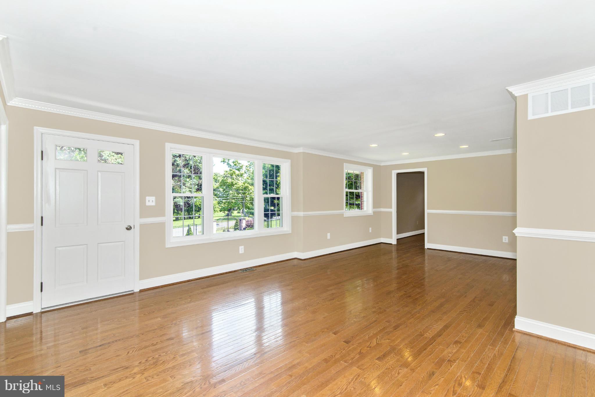 18126 Beallsville Road Poolesville, MD 20837 - Photo 6 of 21 an empty room with wooden floor and windows