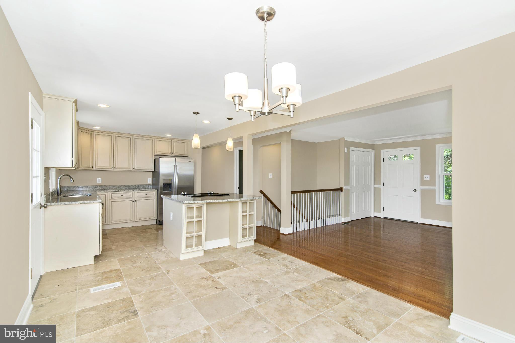 18126 Beallsville Road Poolesville, MD 20837 - Photo 9 of 21 a view of a kitchen with a sink stainless steel appliances and cabinets
