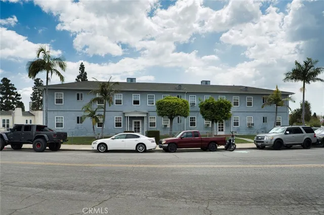a view of cars parked in front of a building