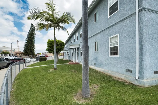 a house with palm tree in front of it