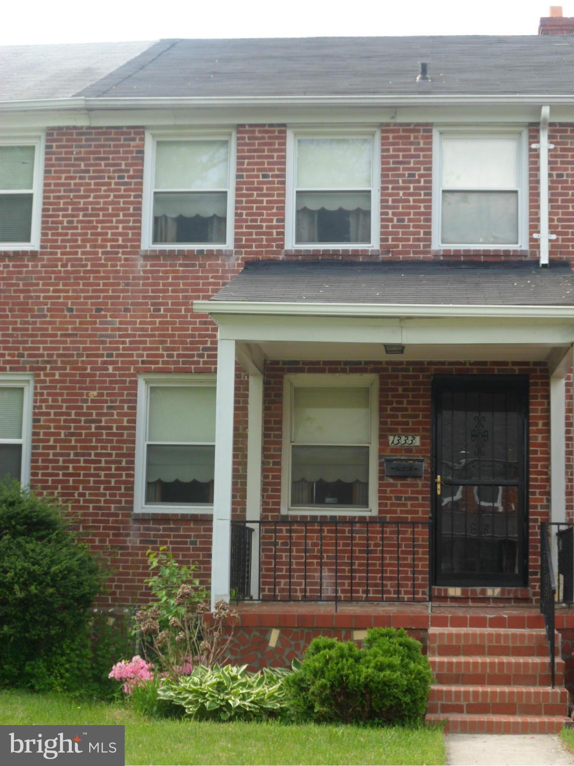 1333 Stonewood Road Baltimore, MD 21239 - Photo 1 of 30 a view of front door of house with yard