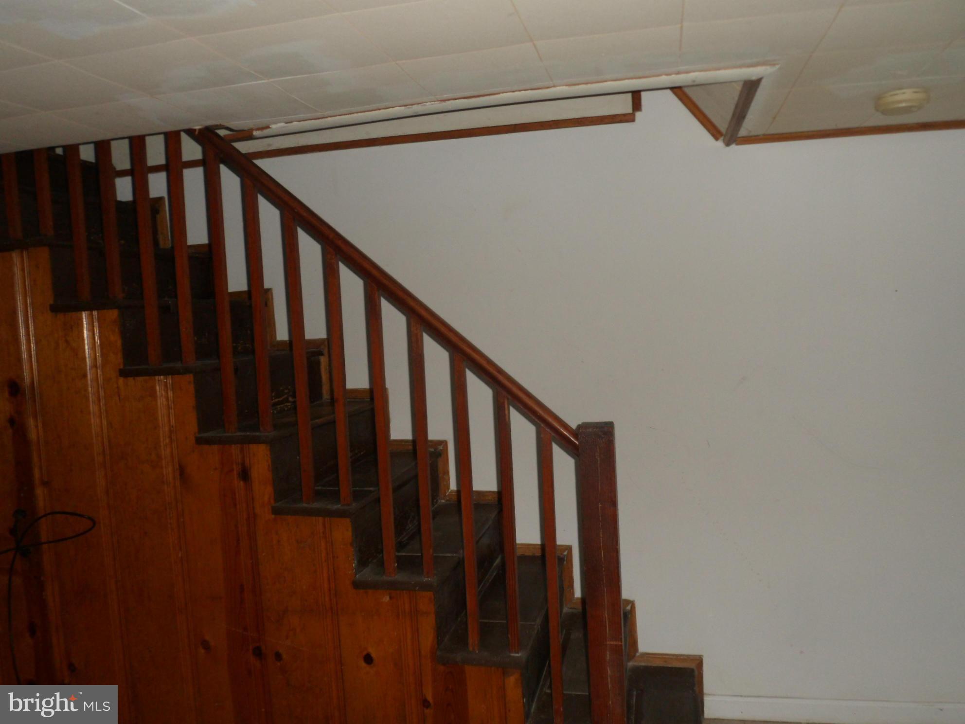 1333 Stonewood Road Baltimore, MD 21239 - Photo 14 of 30 a view of staircase with railing and white walls