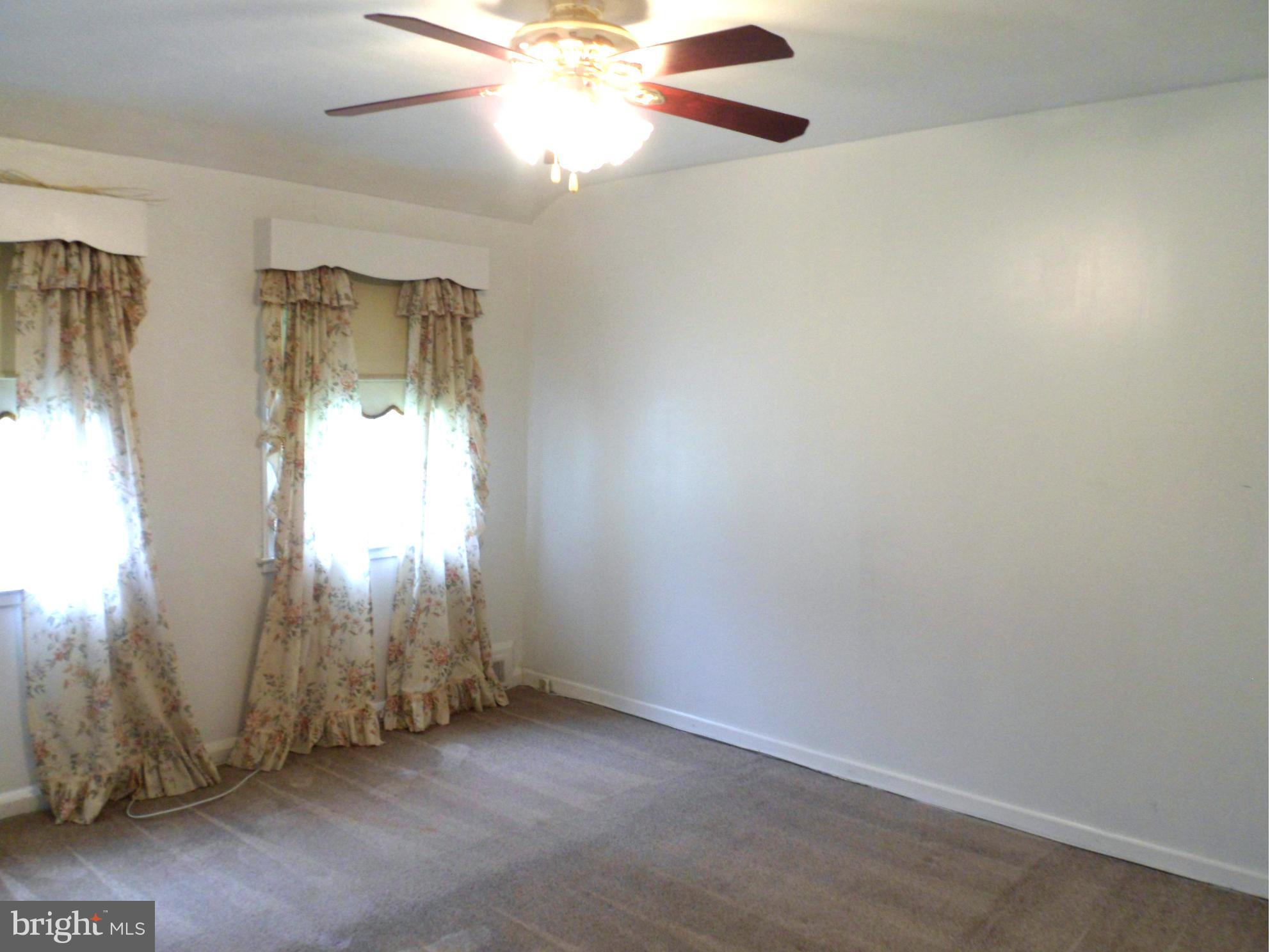 1333 Stonewood Road Baltimore, MD 21239 - Photo 23 of 30 an empty room with windows and closet