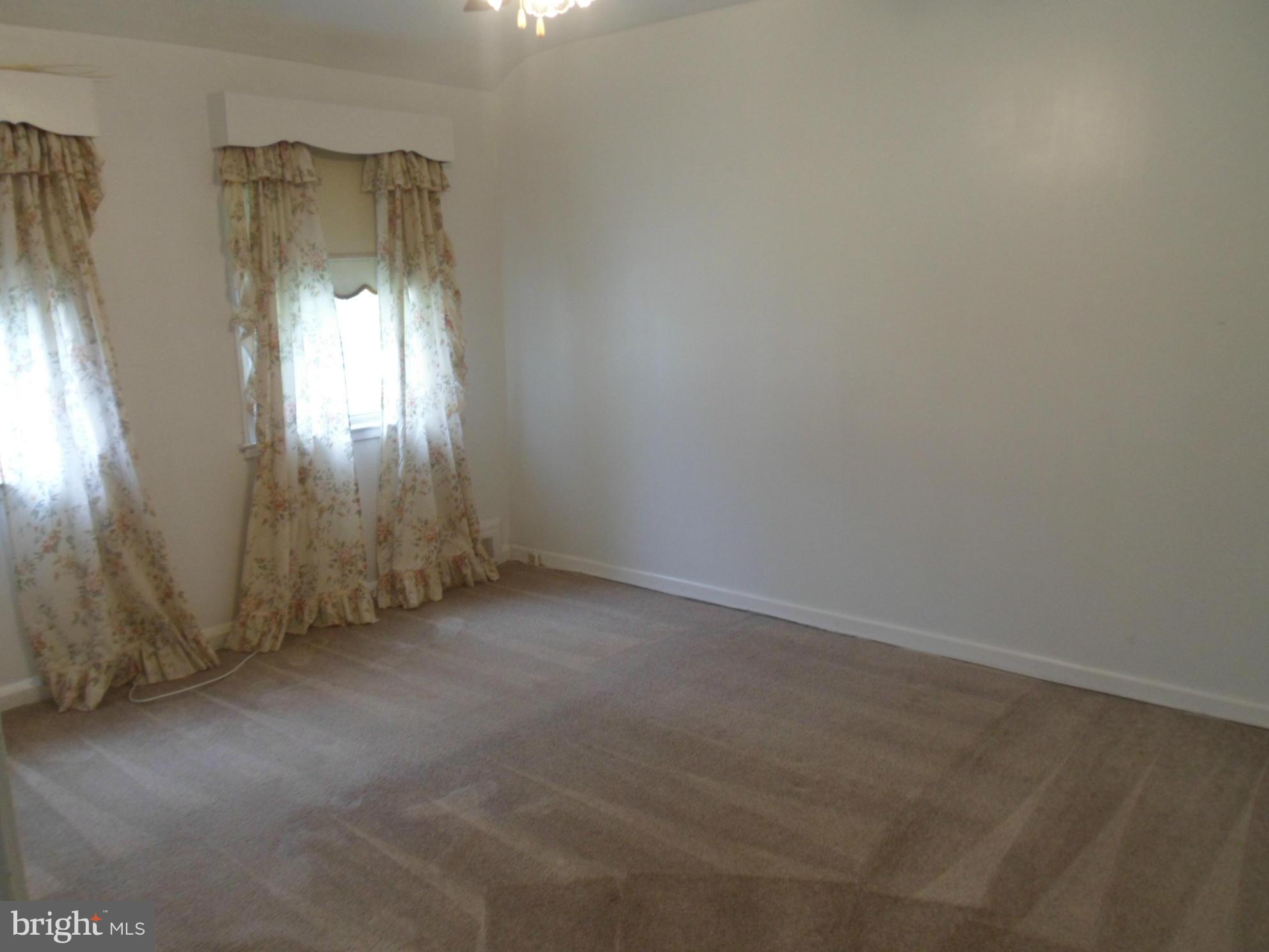 1333 Stonewood Road Baltimore, MD 21239 - Photo 24 of 30 an empty room with windows and closet