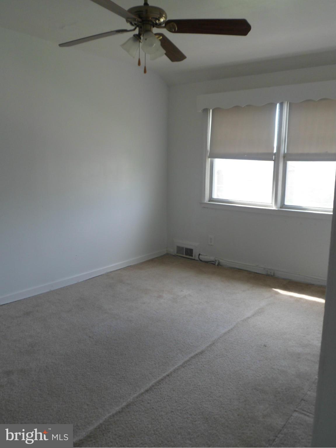 1333 Stonewood Road Baltimore, MD 21239 - Photo 25 of 30 an empty room with a window