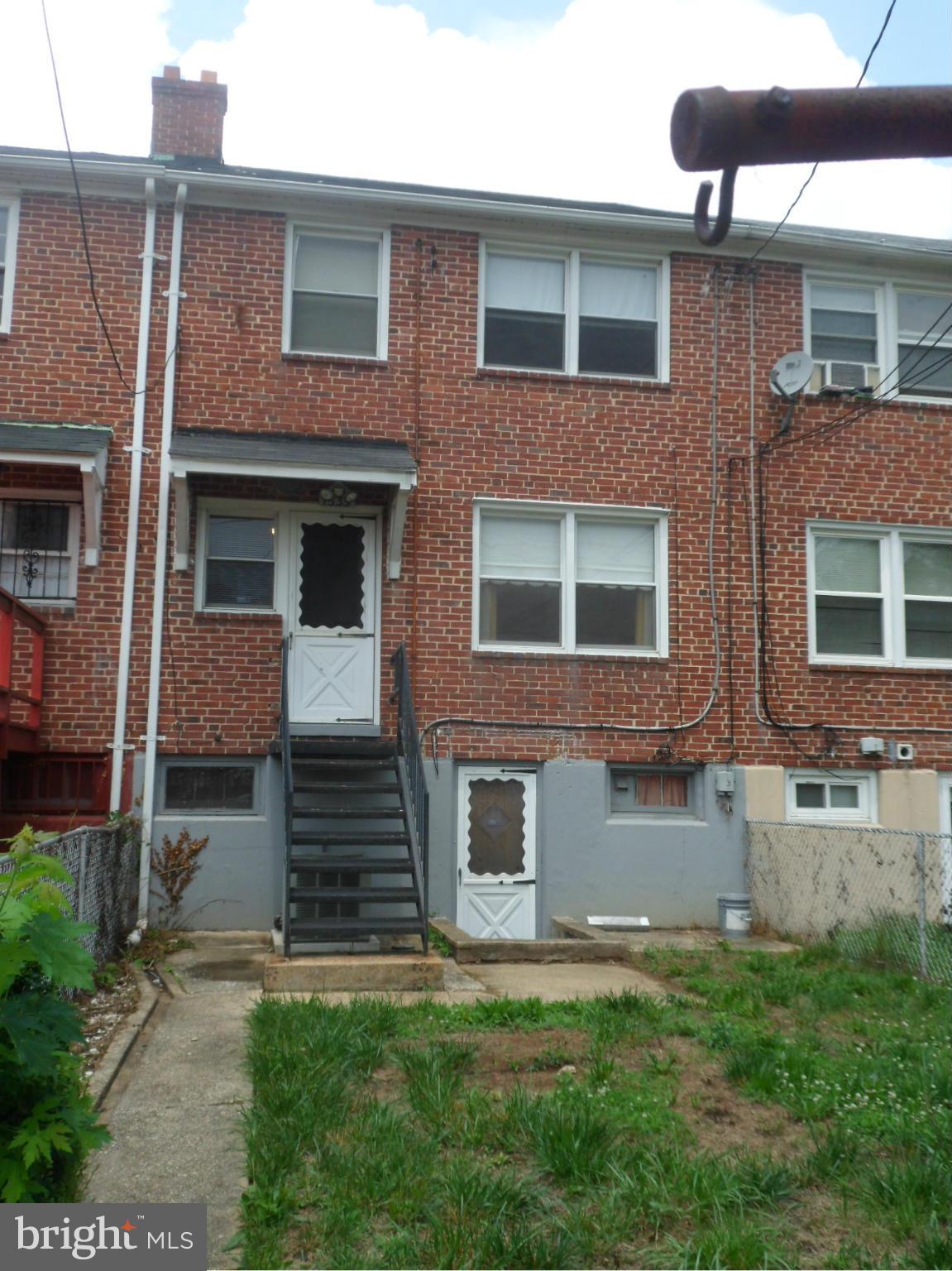 1333 Stonewood Road Baltimore, MD 21239 - Photo 28 of 30 a front view of a house with garden