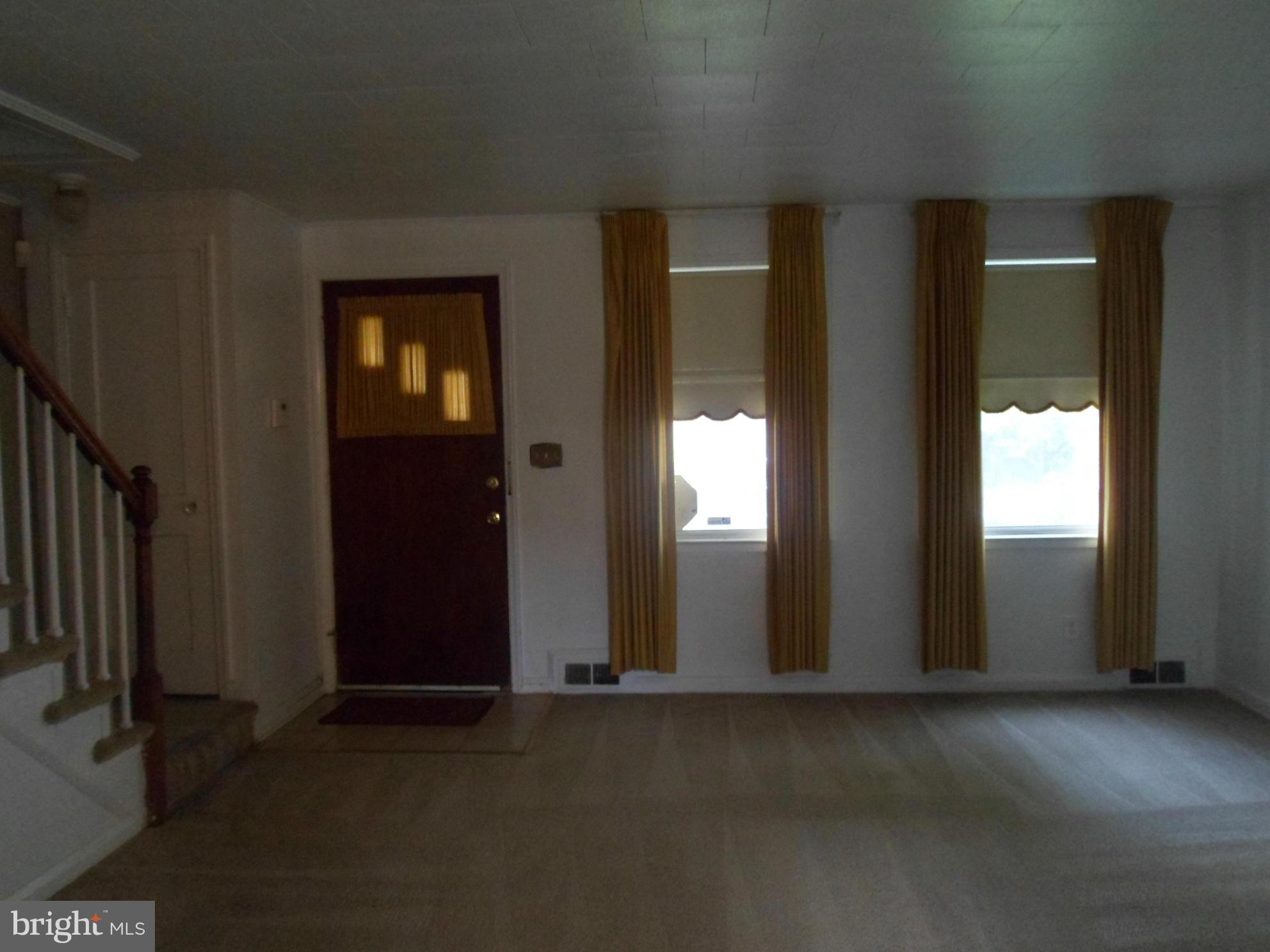 1333 Stonewood Road Baltimore, MD 21239 - Photo 4 of 30 an empty room with windows