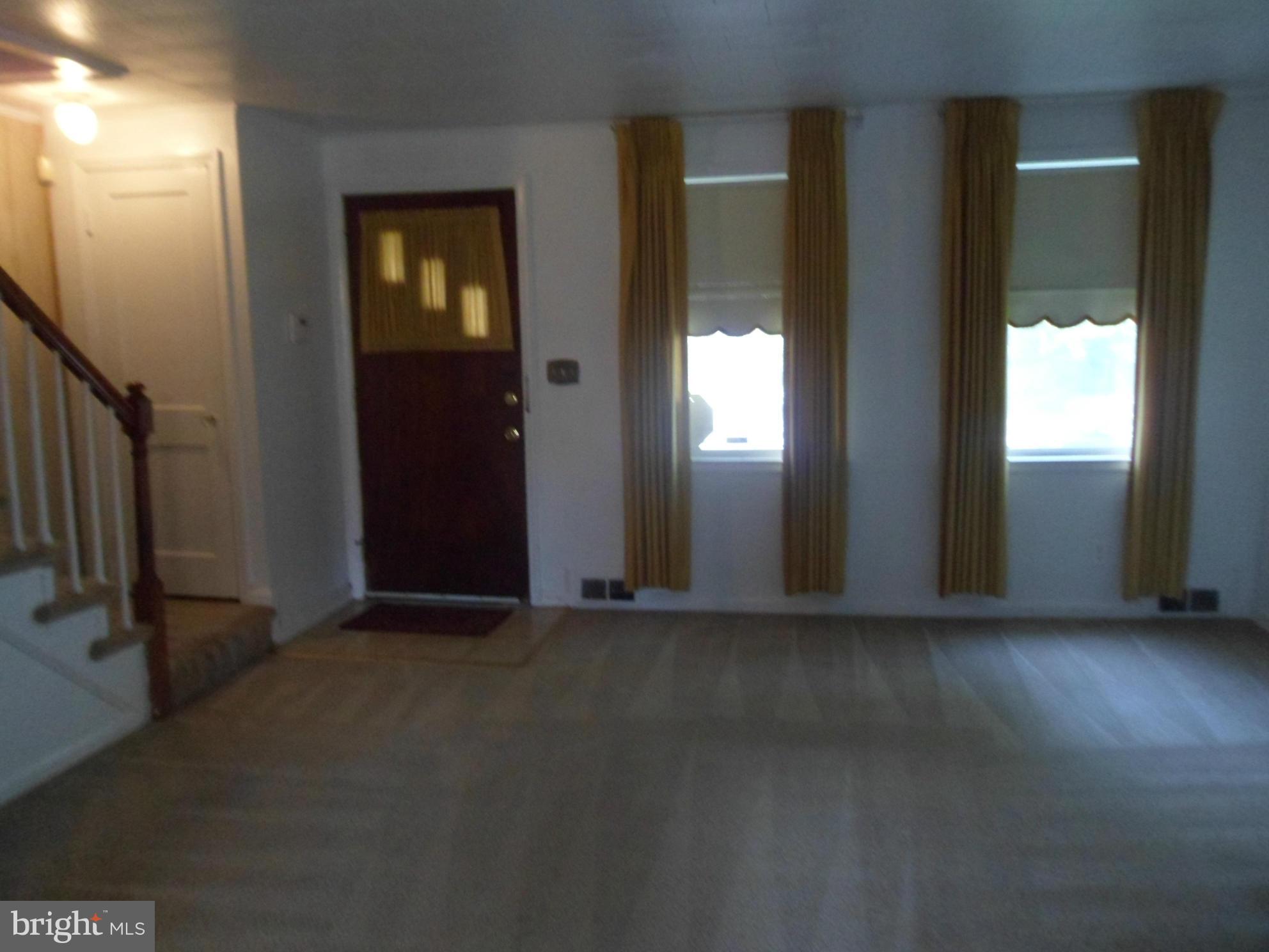 1333 Stonewood Road Baltimore, MD 21239 - Photo 5 of 30 an empty room with windows