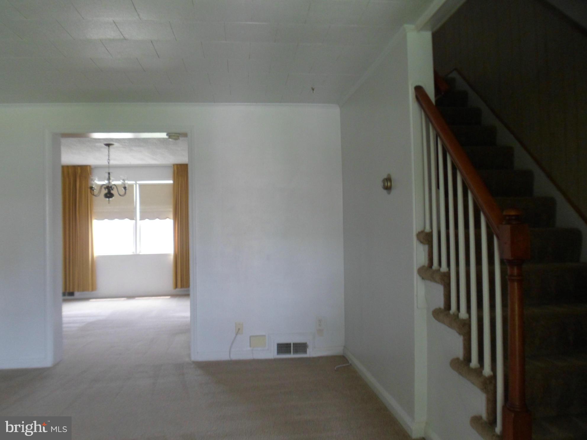 1333 Stonewood Road Baltimore, MD 21239 - Photo 6 of 30 a view of a room with a hallway